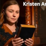 a person holding a book kristen archives